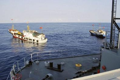 Two Chinese trawlers stop directly in front of the military Sea lift Command ocean surveillance ship USNS Impeccable in the South China Sea