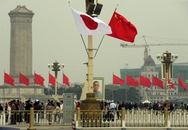 This 2009 photo shows Chinese and Japanese flags flying over Tiananmen Square at the time that then Japanese leader Taro Aso visited Beijing (Photo: Getty Images).
