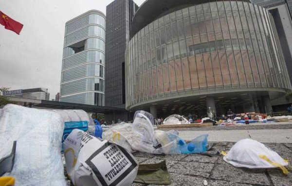 Discarded safety goggles and face masks lie on the ground outside Hong Kong's Legislative Council after the removal of the last protesters camped outside Legislative Council, during the Occupy Central and Umbrella Movement, Hong Kong, China, 15 December 2014. (Photo: AAP)