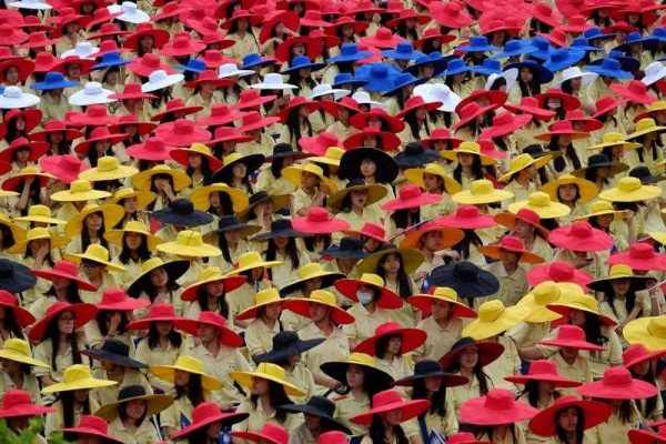 Taiwanese students wear colourful hats during the national day anniversary in front of the Presidential Palace in Taipei on 10 October 2014. (Photo: AAP).