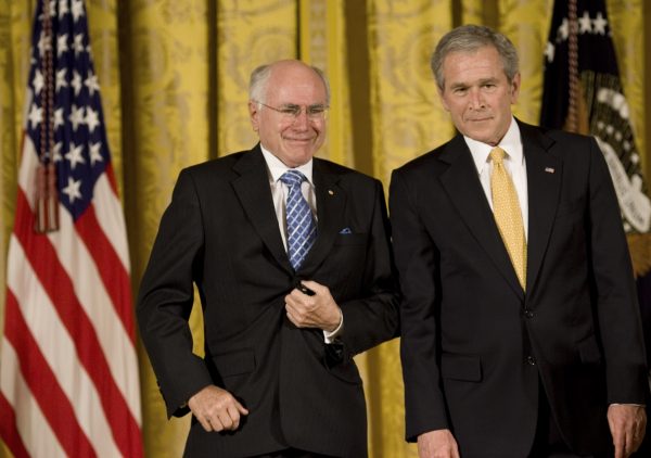 Former Australian Prime Minister John Howard and former President of the United States George Bush, in Washington, 2009. Australia and the United States have reduced their trade by US$53 billion with rest of the world and are worse off than they would have been without the Australia–United States free trade agreement. (Photo: AAP).
