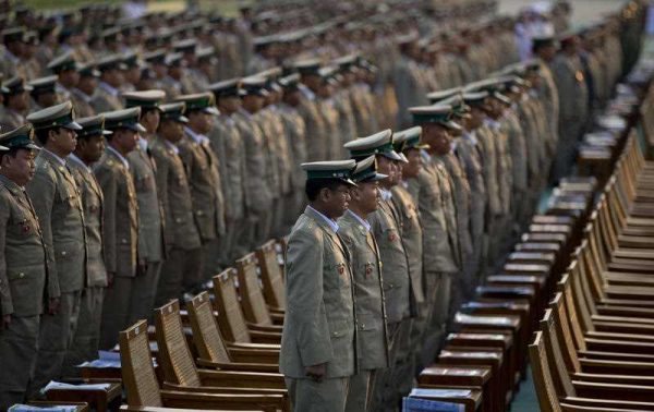 Military officers stand during Myanmar’s 68th anniversary celebrations of Armed Forces Day on 27 March 2013. Engaging the military is essential in developing lasting reform. (Photo: AAP).