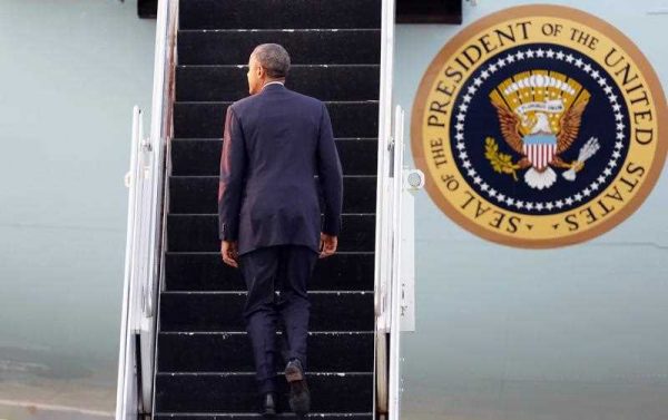 US President Barack Obama boards Air Force One after a trip to Asia in late 2014. (Photo: AAP).