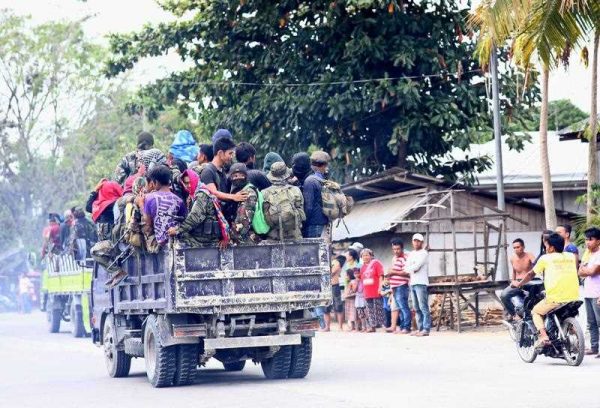 Members of Moro Islamic Liberation Front (MILF) aboard trucks after they were asked to reposition their fighters to pave a way for the government all out offensive against muslim rebels the Bangsamoro Islamic Freedom Fighters in Datu Unsay town, Maguindanao province, southern Philippines, 27 February 2015. (Photo: AAP)