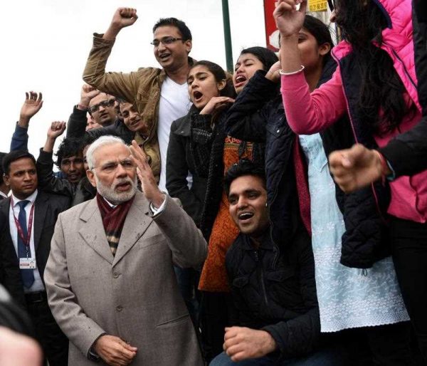 Indian Prime Minister Narendra Modi poses with supporters on 11 April 2015 after his visit at the WWI Indian Memorial of Neuve-Chapelle-Richebourg, northern France. (Photo: AAP)