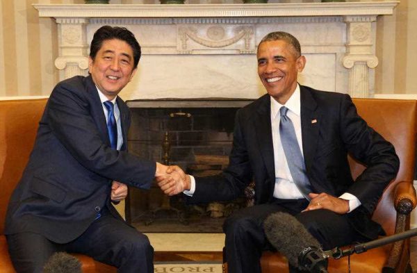 Japanese Prime Minister Shinzo Abe and US President Barack Obama shake hands during a summit meeting at the White House in Washington, DC, USA. on 28 April 2015. (Photo: AAP)