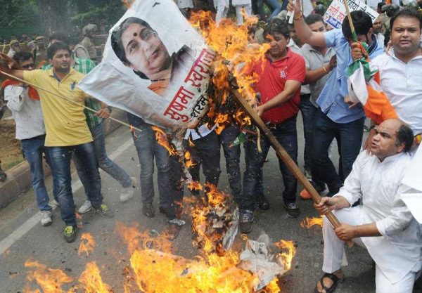 Protestors demonstrate outside the home of India's Minister of External Affairs Sushma Swaraj on June 15, 2015 Swaraj is alleged to have tried to help Lalit Modi, the former chief of India's richest sports league, obtain British travel documents, according to Reuters. (Photo: AAP)