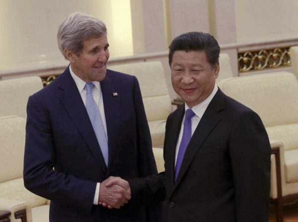 US Secretary of State John Kerry shakes hands with Chinese President Xi Jinping in Beijing, China, May 17, 2015. Tensions are growing between the U.S. and China over suspicions that Beijing was behind the biggest cyber breach of federal personnel records. (Photo: AAP)