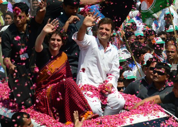 Congress Party vice-president Rahul Gandhi and his sister Priyanka were showered with flowers as Rahul drove to nominate for election in April 2014. But the family magic didn't work for Congress this time. (Photo: AAP)
