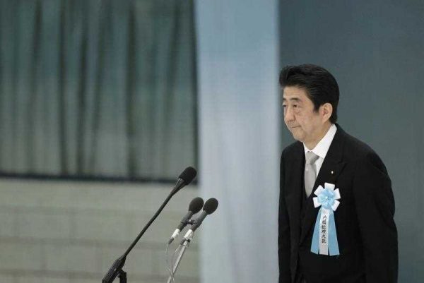 Japanese Prime Minister Shinzo Abe makes his speech during the memorial service at Nippon Budokan Hall in Tokyo, Japan, 15 August 2015. (Photo: AAP)