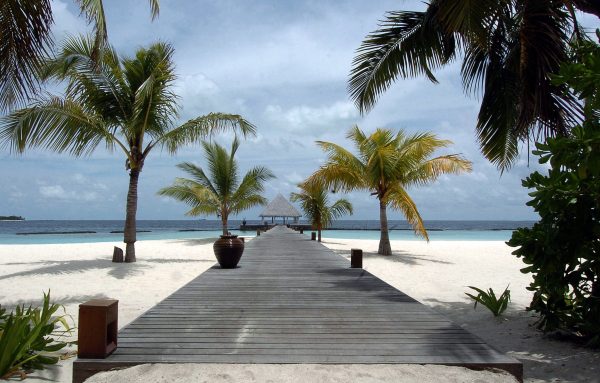 This picture taken 17 August 2007 shows the wooden entrance leading to the Coco Palm resort on the Boduhithi Island, Maldives (Photo: AAP)