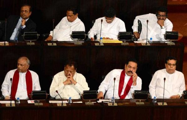 Former Sri Lankan president and Member of Parliament Mahinda Rajapakse (2R, Bottom) attends the inauguration of parliament in Colombo on September 1, 2015. Rajapakse failed to stage a comeback as prime minister at August 17 elections after losing the January 8, 2015 presidential election after a decade in power. (Photo: AAP)