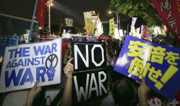 Demonstrators protest against controversial national security bills outside Japan's parliament in Tokyo, Japan, 16 September 2015. (Photo: AAP)