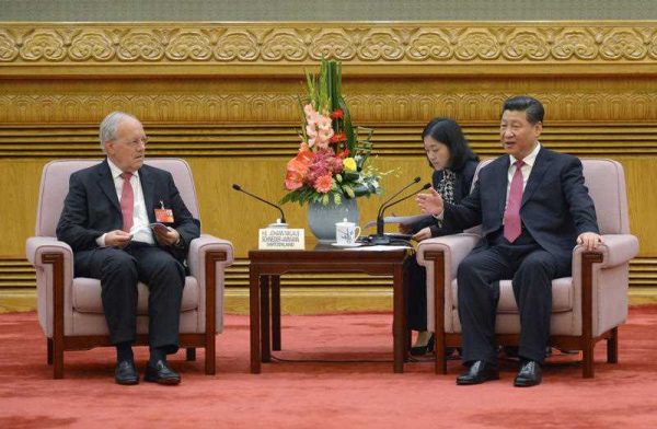 Chinese President Xi Jinping, right, speaks to Swiss Economy Minister Johann Schneider-Ammann as he meets with delegates attending the signing ceremony for the Articles of Agreement of the Asian Infrastructure Investment Bank (AIIB) at the Great Hall of the People in Beijing Monday, 29 June 2015. (Photo: AAP)