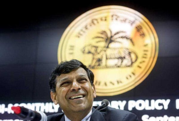 Reserve Bank of India governor Raghuram Rajan smiles during a press conference in Mumbai, India, Tuesday, 29 September 2015. India's central bank on Tuesday cut its key interest rate by half a percentage point, aiming to spur economic growth as inflation cooled to the lowest since November. (Photo: AAP)