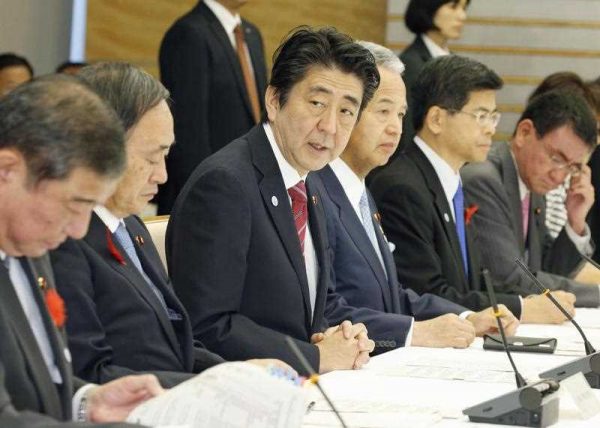 Japanese Prime Minister Shinzo Abe addresses the inaugural meeting at the government's headquarters on domestic measures for the Trans-Pacific Partnership trade initiative on October 9, 2015, in Tokyo. He vowed to implement measures to beef up the country's agricultural sector in the wake of the landmark free trade accord involving Japan, the United States and 10 other Pacific Rim countries. (Photo: AAP)
