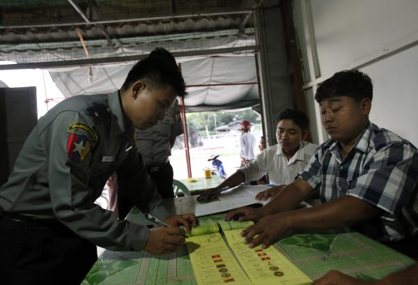 A Myanmar police officer casts his ballot in advance to Nov. 8 general elections at a government office in Naypyitaw, Myanmar Thursday, Oct. 29, 2015. Advance polling commenced in Myanmar on Thursday for those unable to cast a ballot in their electorates on polling day next week, (Photo: AAP).