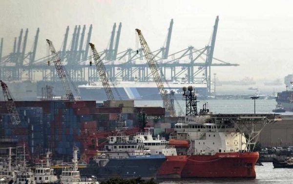 Ships and shipping containers in Jurong port in Singapore (Photo AAP)