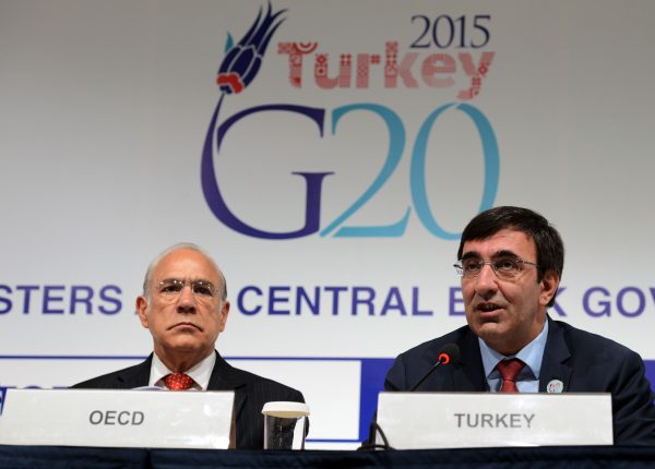 The Secretary-General of the Organization for Economic Cooperation and Development (OECD), Angel Gurria (L), and Turkish Deputy Prime Minister Cevdet Yilmaz, are pictured during a G-20 Governors' press conference at the IMF/World Bank Annual Meetings, in Lima, Peru, on October 9, 2015. (Photo: AAP).