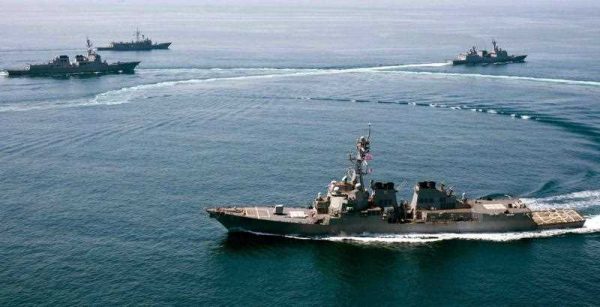 A handout photo released by the US Navy dated 25 May 2015 of the guided-missile destroyer USS Lassen conducting a trilateral naval exercise with the Turkish and South Korean Navy in support of theatre security operations in waters to the south of the Korean Peninsula. The destroyer USS Lassen sailed within 12 nautical miles of Subi Reef in the Spratly archipelago, one of the areas where Beijing has allegedly been building artificial islands, on 27 October 2015. (Photo: AAP)