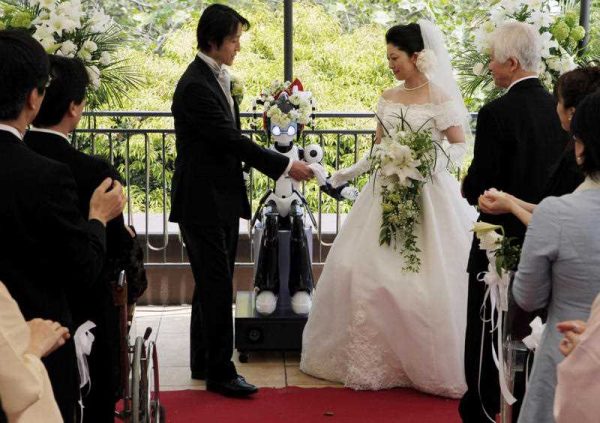 I-Fairy, a four-foot tall seated robot directs a wedding ceremony in Japan. (Photo:AAP)