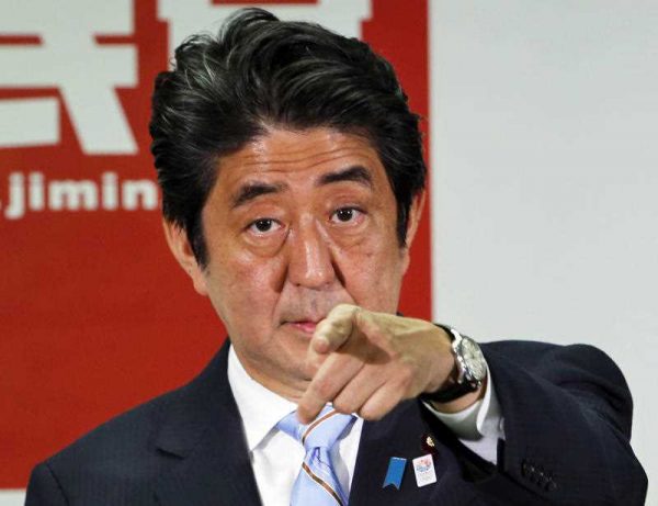 n this July 22, 2013 file photo, Japanese Prime Minister Shinzo Abe, president of the Liberal Democratic Party, points a reporter during a press conference in Tokyo. (Photo: AAP)