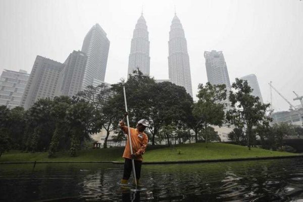 Kuala Lumpur City Centre, location of the 2015 ASEAN Summit, shrouded in haze (Photo: AAP)