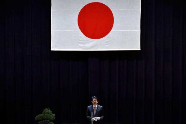 apaese Prime Minister Shinzo Abe delivers a speech for the high-ranking officials of the Defense Ministry after reviewing the salute of a guard of honor at the ministry in Shinjyuku Ward, Tokyo on Dec. 16, 2015. (Photo: AAP)