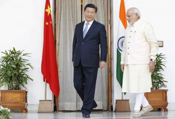 Chinese President Xi Jinping with Indian prime minster Narendra Modi in New Delhi, 18 September 2014. (Photo: AAP)