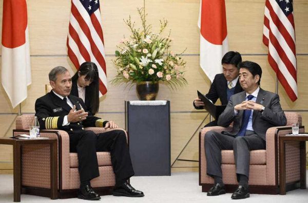 US Navy Admiral Harry B. Harris Jr., commander of the United States Pacific Command, with Japanese Prime Minister Shinzo Abe during a meeting in Tokyo on 16 February 2016. (Photo: AAP).