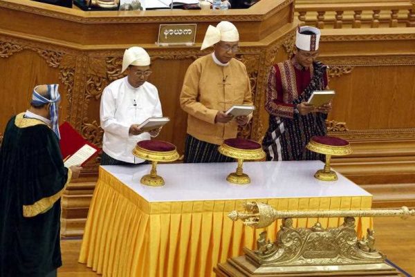 Myanmar President Htin Kyaw (C), and Myanmar Vice Presidents Myint Swe (L) and Henry Van Thio (R) are sworn in during the oath taking ceremony at the Union Parliament in Naypyitaw, Myanmar, 30 March 2016. (Photo: AAP).