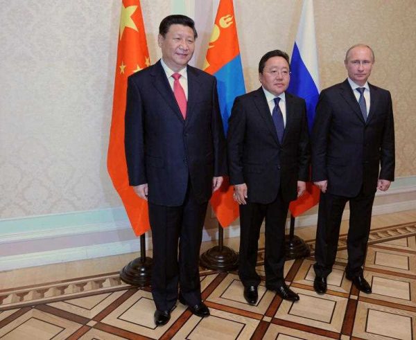 Russian President Vladimir Putin, Mongolian President Tsakhiagiin Elbegdorj and their Chinese counterpart Xi Jinping at the Shanghai Cooperation Organization Heads of State Summit in Tajikistan, September 2014. (Photo: AAP)