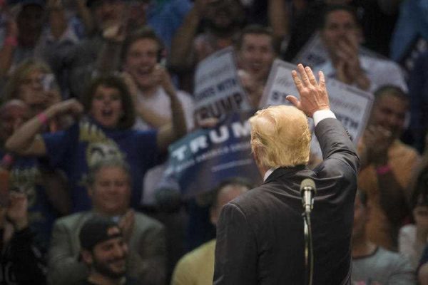 Republican presidential candidate Donald Trump waves to the crowd during a campaign stop at the First Niagara Center, in Buffalo, USA, April 18, 2016. (Photo: AAP).