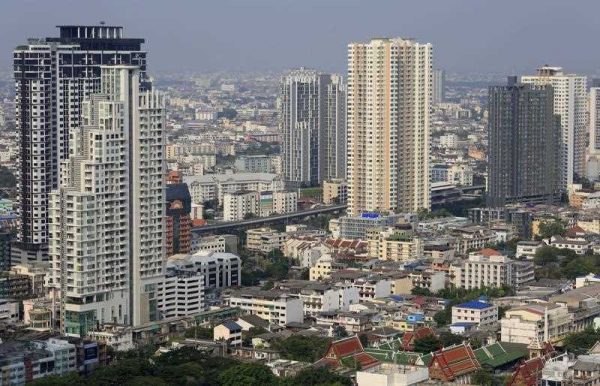 Picture made available 20 May 2016, shows a view of the urban build up in Thai capital of Bangkok, with a Buddhist temple (lower R)nestled into apartment buildings, in Bangkok, Thailand. (Photo: AAP).