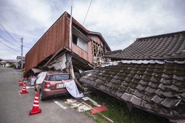 Collapsed houses and damaged cars, one month after series of devastating earthquakes that struck eastern Kumamoto suburb of Mashiki and neighbouring areas on 14 April and 16 April, 2016. (Photo: AAP).