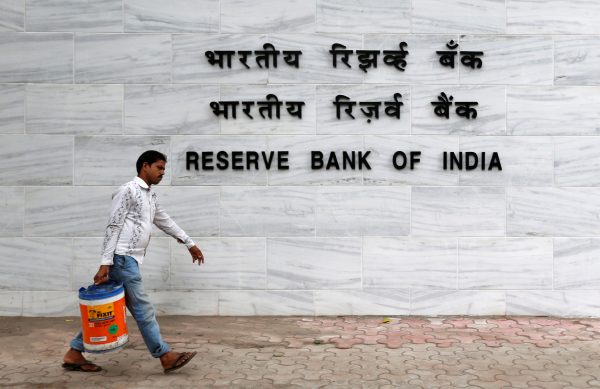 A man walks past the Reserve Bank of India (RBI) head office in Mumbai, India. (Photo: Reuters).