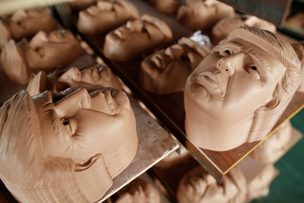 Masks of US Republican Party presidential candidate Donald Trump are seen drying on shelves at a factory in Jinhua, Zhejiang Province, China, 25 May 2016. (Photo: Reuters).