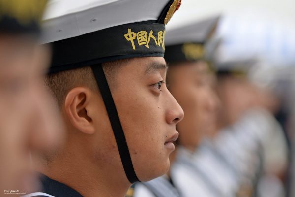 Chinese sailors of the PLA Navy Ship Changbai Shan, a Type 071 amphibious transport dock, line the deck. (Photo: Flickr).