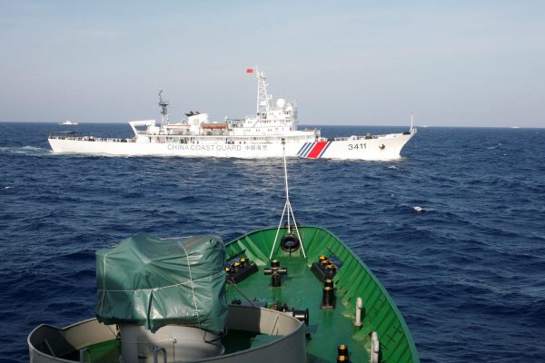 A ship of the Chinese Coast Guard is seen near a ship of the Vietnamese Marine Guard in the South China Sea, about 210 kilometres off the shore of Vietnam. (Photo: Reuters).