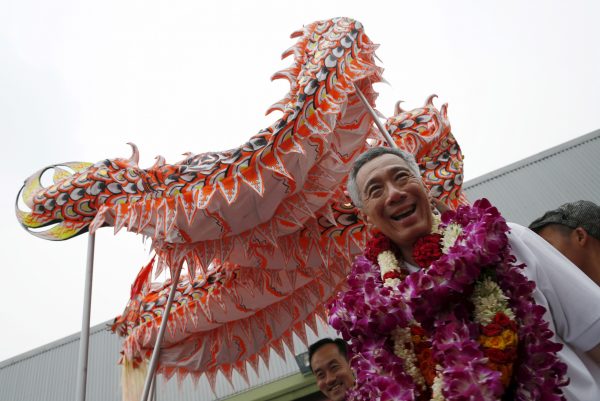 Singapore's Prime Minister and Secretary-General of the People's Action Party (PAP) Lee Hsien Loong is greeted with a dragon dance as he thanks supporters after the general election in Singapore, 12 September 2015. (Photo: Reuters/Edgar Su).