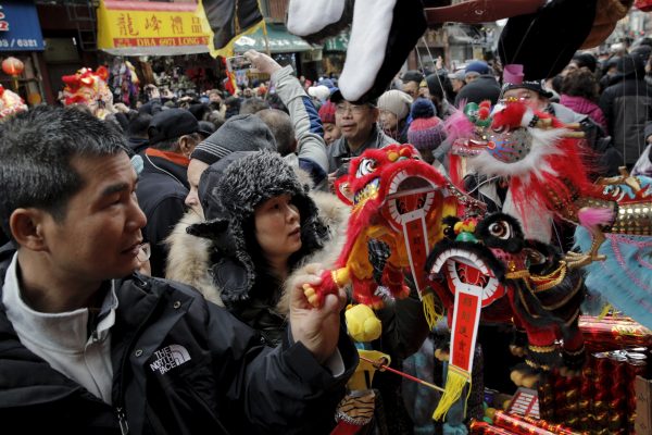 People celebrate the Chinese Lunar New Year in Chinatown in New York, 8 February, 2016. (Photo: Reuters/Brendan McDermid).