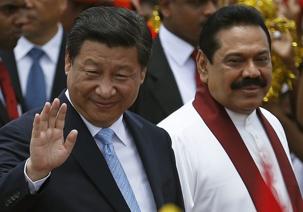 Chinese President Xi Jinping and former Sri Lankan president Mahinda Rajapaksa, whose government actively courted Chinese investment and engagement. (Photo: Dinuka Liyanawatte/Reuters).