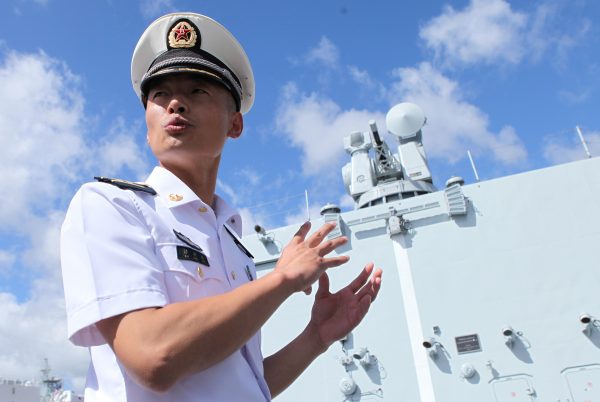 Chinese PLA Navy officer Commander Sun Hongbin talks to reporters about the defense armament aboard the PLAN replenishment ship Gaoyouhu at Joint Base Pearl Harbor Hickam while they are there to participate in the multi-national military exercise RIMPAC in Honolulu, Hawaii, 8 July 2016. (Photo: Reuters/Hugh Gentry).