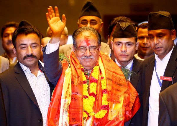 Nepal's newly elected Prime Minister Pushpa Kamal Dahal waves towards the media after he was elected Nepal's 24th prime minister in 26 years, in Kathmandu, Nepal, 3 August, 2016. (Photo: Reuters/Navesh Chitrakar).