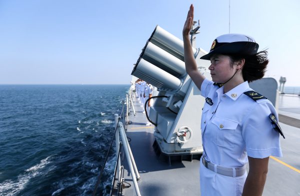 A Chinese soldier waves farewell to Russian fleets as the Chinese-Russian joint naval drill concludes in Zhanjiang, Guangdong Province, China, 19 September, 2016. (Photo: Reuters/Stringer).