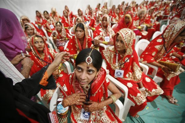 Muslim brides await a mass marriage ceremony in Ahmedabad, Gujarat, 3 March, 2013 (Photo: Reuters/Amit Dave).