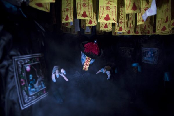 Theatrical zombies like this performer in Hong Kong vanish after Halloween, but zombie companies just hang around, holding back China's economy. (Photo: Tyrone Siu/Reuters).