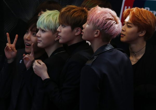 Members of South Korean K-Pop band BTS react on the red carpet during 2015 Mnet Asian Music Awards (MAMA) in Hong Kong, China, 2 December 2015 (Photo: Reuters/Bobby Yip)