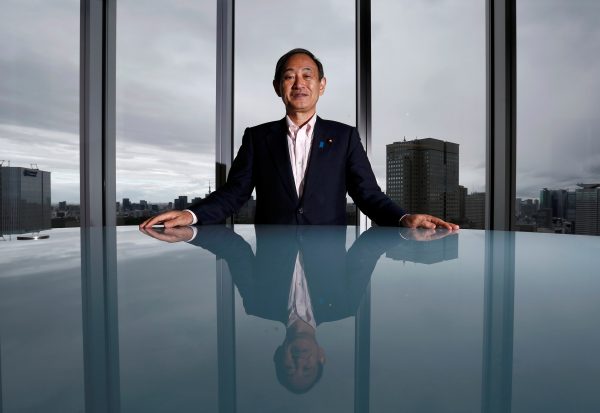 Japan's Chief Cabinet Secretary Yoshihide Suga poses for a photograph during a Thomson Reuters Newsmaker event in Tokyo, Japan 30 August 2016. (Photo: Reuters/Kim Kyung).