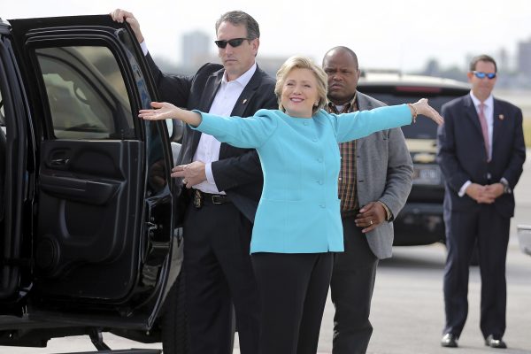 US Democratic presidential candidate Clinton reacts before boarding her campaign plane (Photo: Reuters).